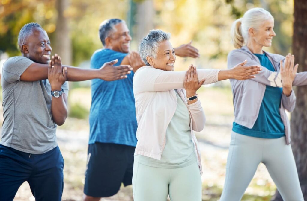 Seniors doing stretches for their posture in an outdoor class