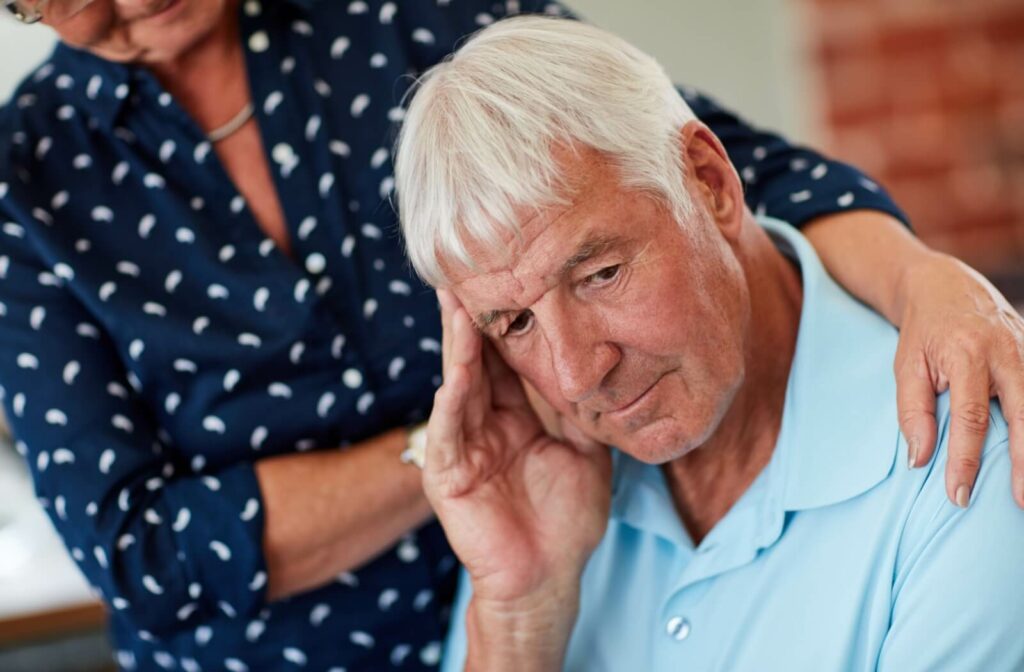 Worry, sad and thoughtful elderly person with woman for Alzheimers, mental health or dementia with nostalgia