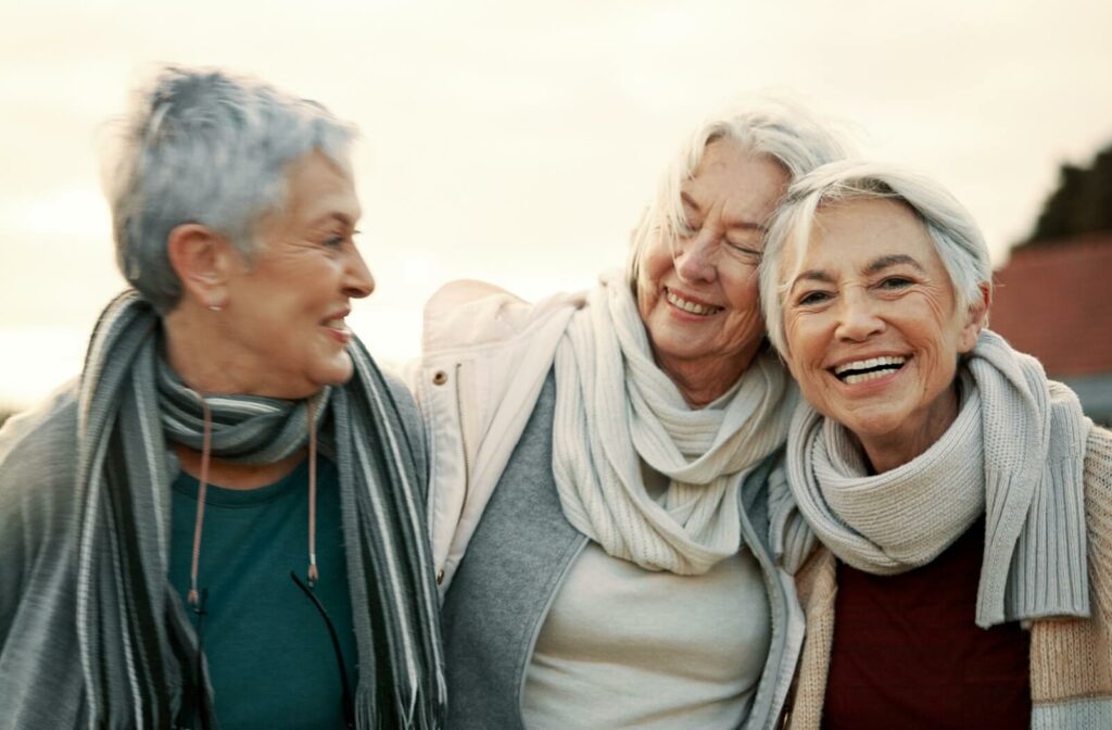 group of seniors enjoying each others company outdoors