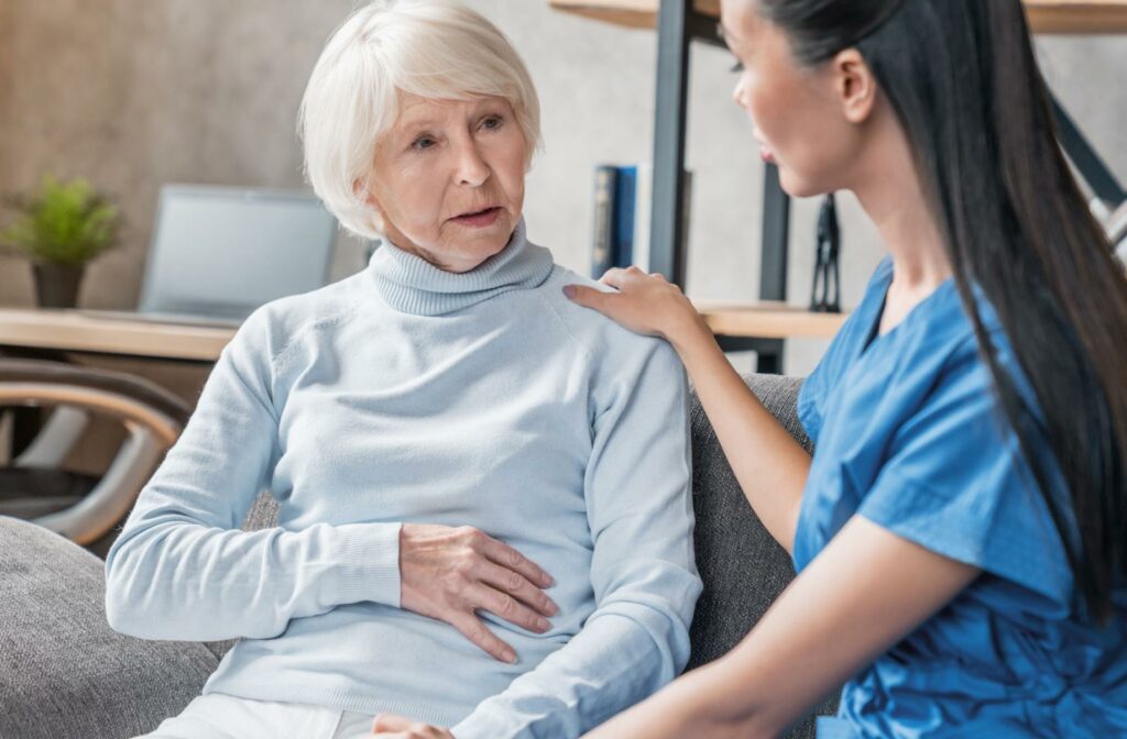 senior being comforted by a carer